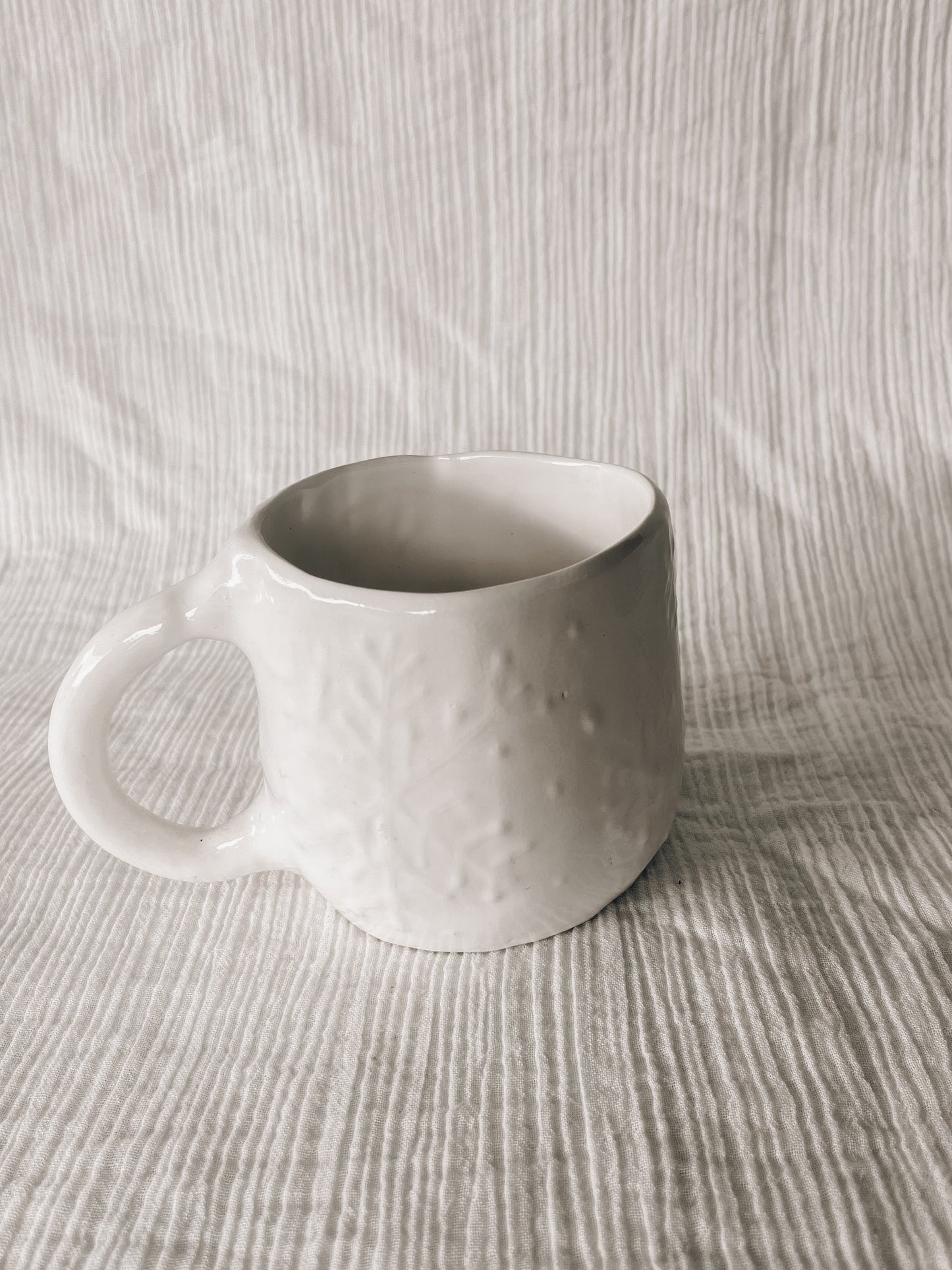 White snowflake hug mug