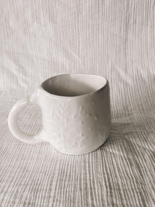 White snowflake hug mug